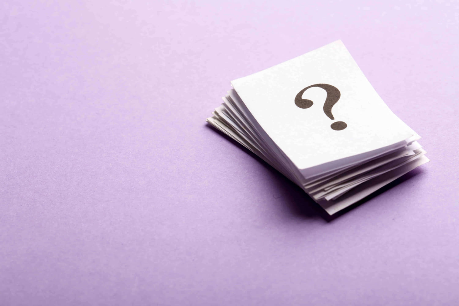 Stack of cards with a question mark on them